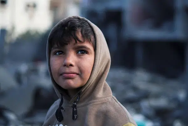 | A Palestinian boy at the site of Israeli strikes on a mosque and houses in Rafah in the southern Gaza Strip on January 25 | Ibraheem Abu Mustafa Reuters | MR Online